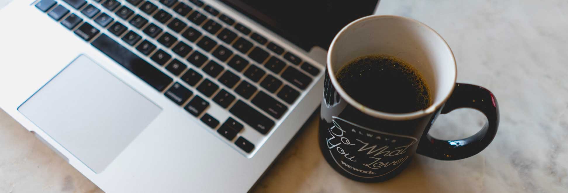 Image of laptop and coffee