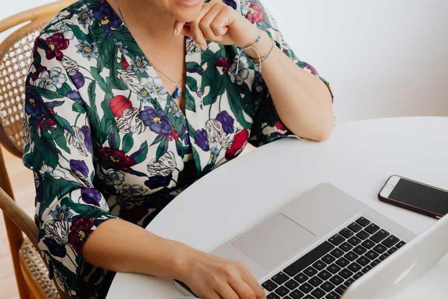 Women working on laptop blogging for her small business